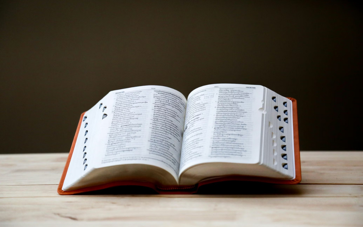 Open dictionary book on a table — plain-English glossary of inherited home and probate terms for sellers
